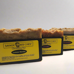 Three handcrafted SAVAGE BEE-CHES Beeswax Cleansing Bars: Lemon Merlot, Lavender, and Cabernet Sauvignon in San Diego.