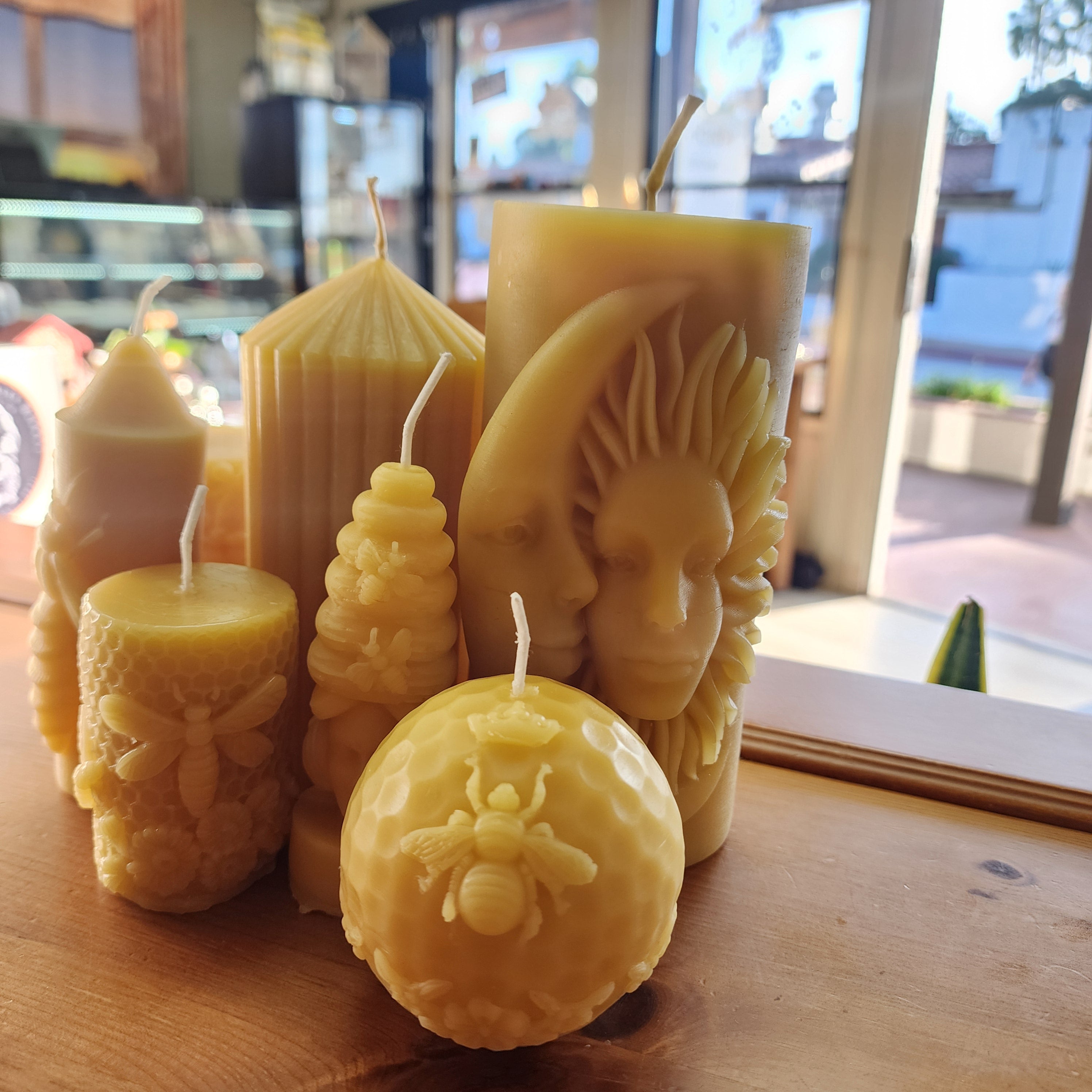 Handcrafted natural beeswax candles in the SAVAGE BEE-CHES boutique